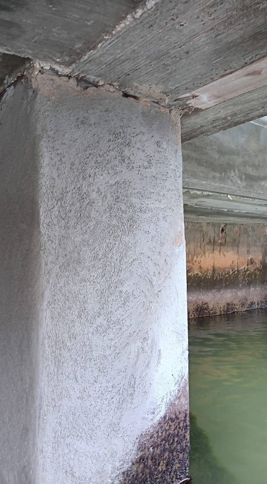 Marine repair team working along a seawall