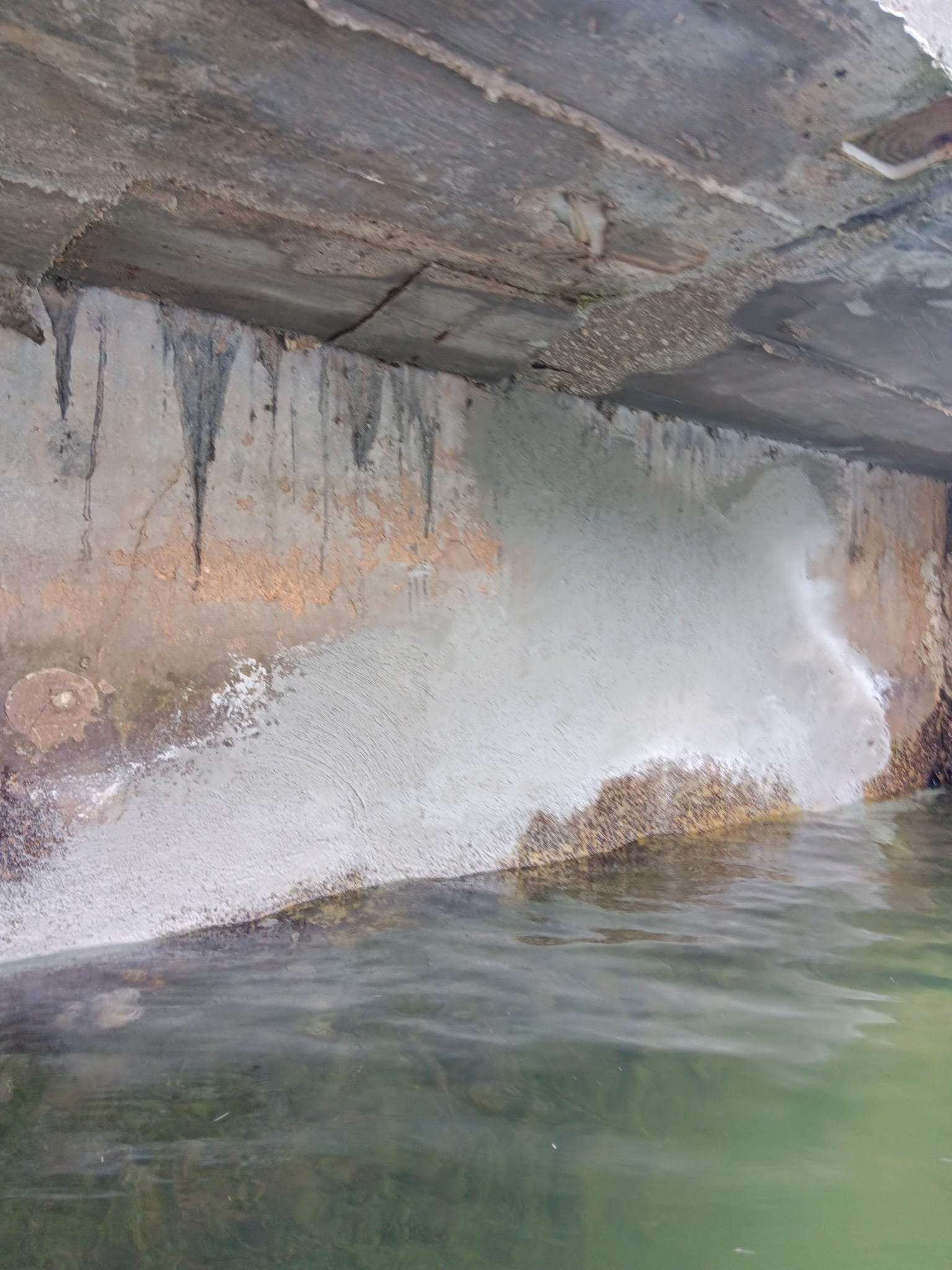 Seawall repair team working along a waterfront dock